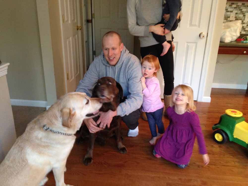 two-labs-and-family-with-three-kids-and-parents